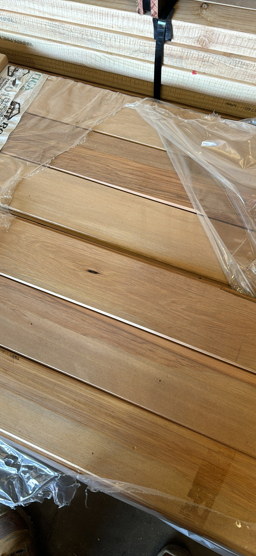 Timber interior linings displayed on a wooden surface, showcasing natural wood grains and finish.