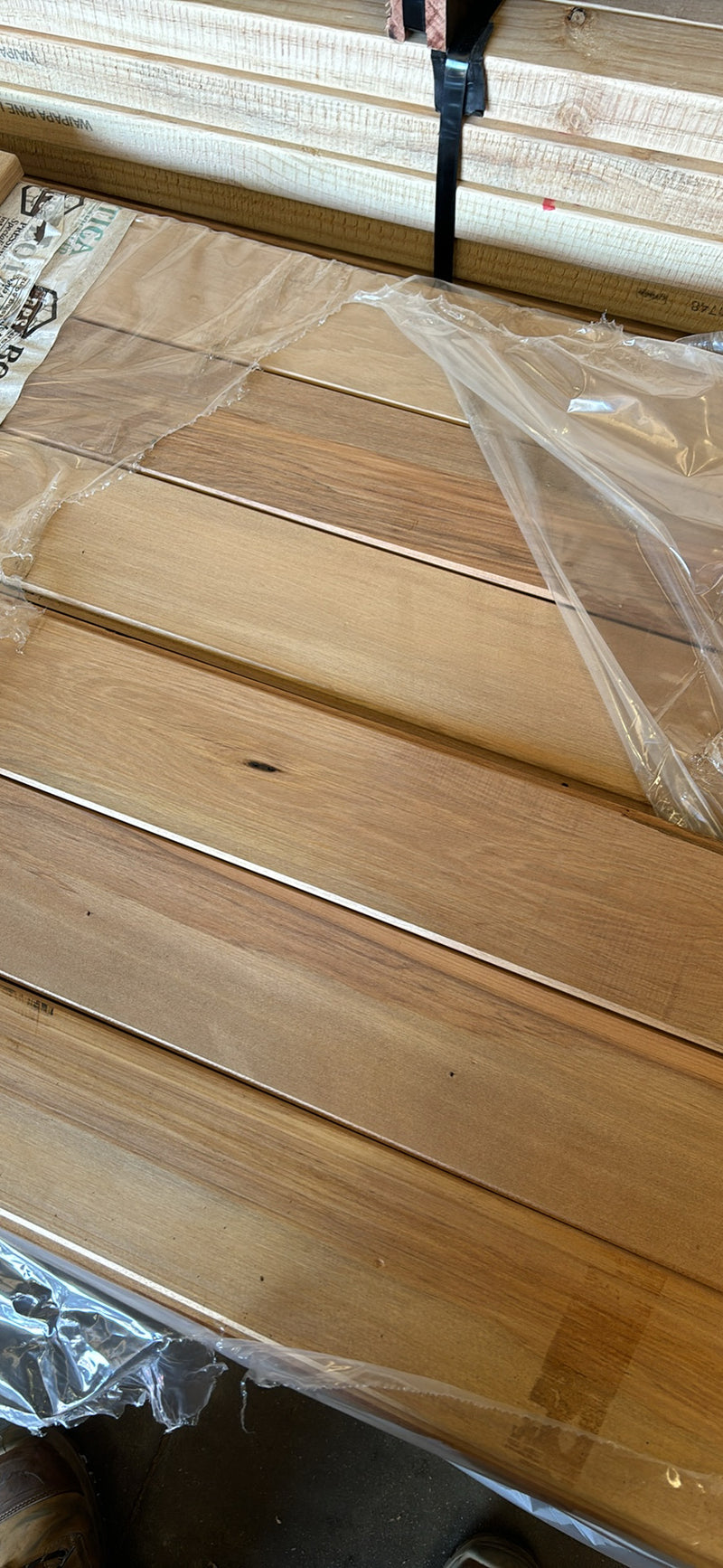 Timber interior linings displayed on a wooden surface, showcasing natural wood grains and finish.